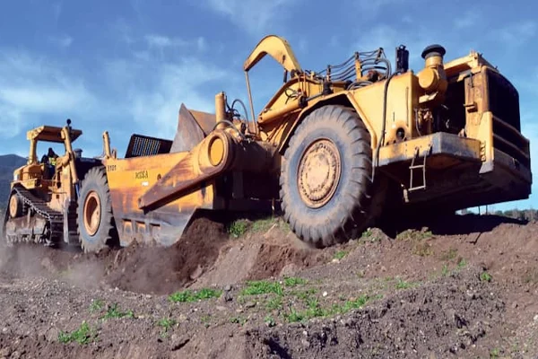 Large yellow earth-moving equipment operating on a construction site representing a heavy equipment apprenticeship pathway