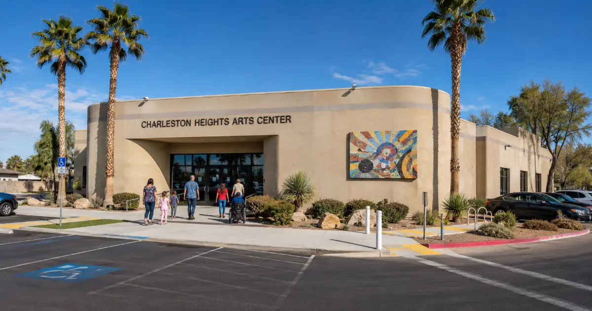 The permanent sign, mosaic artwork, palm trees, and public entrance identify Charleston Heights Arts Center in Las Vegas.