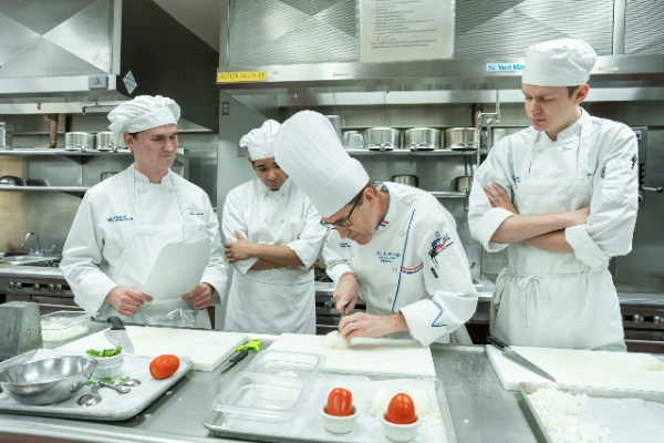 CSN culinary instructor demonstrating techniques to students in a Las Vegas teaching kitchen