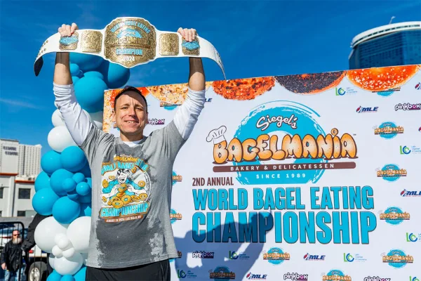 Joey Chestnut stands with his award belt at the Siegels Bagelmania Las Vegas world bagel eating contest