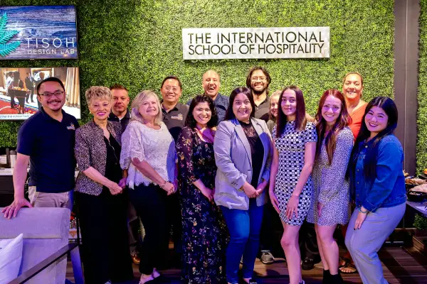 Instructors and students from the international school of hospitality in Las Vegas posing for a group photo