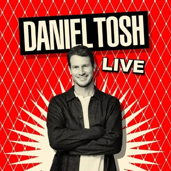 Daniel Tosh Live promotional image featuring Tosh with folded arms against a red patterned background.