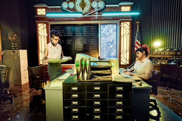 Vintage Continental switchboard office scene from the John Wick Experience at AREA15 Las Vegas featuring clerks, retro equipment, and time‑zone clocks