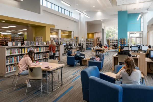 Visitors read, study, browse books, and use public computers inside Whitney Library in Las Vegas.
