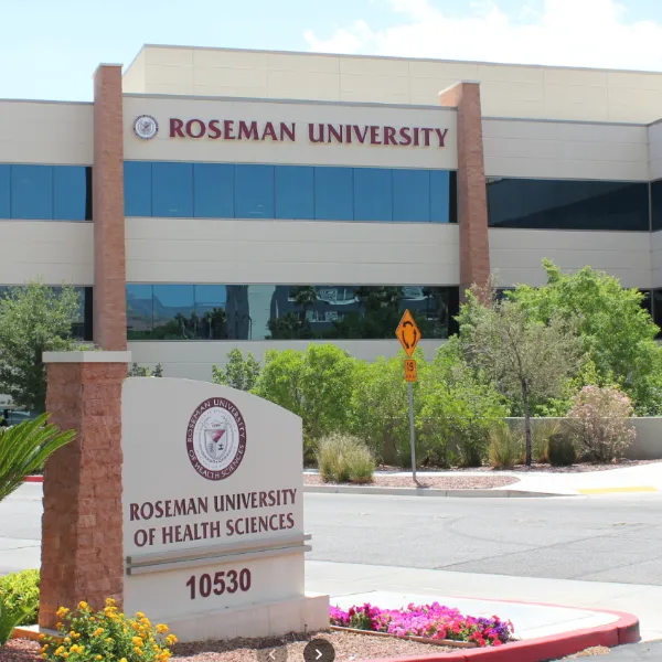 Exterior view of Roseman University’s Summerlin campus featuring the main building, campus signage, and landscaped entrance in Las Vegas