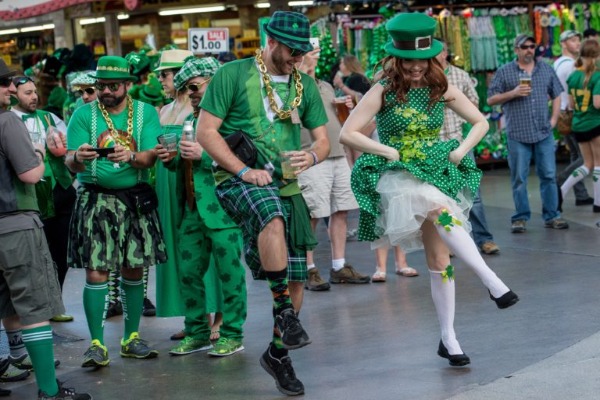 Festive St. Patrick’s Day street celebration in Las Vegas with people dancing in green costumes