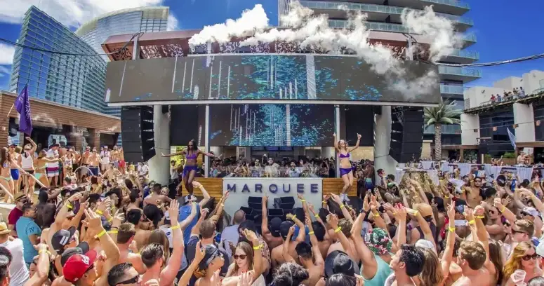People partying at Marquee Dayclub during an LA Epic Las Vegas Pool Crawl party bus tour
