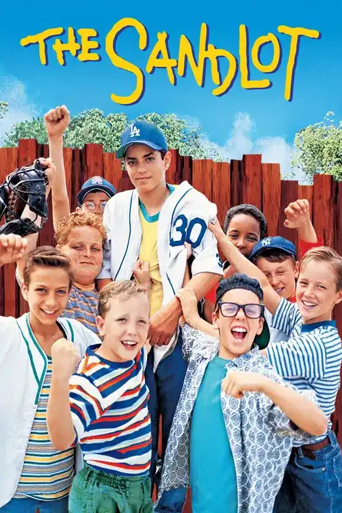 Movie poster for The Sandlot featuring a group of young boys in vintage baseball attire smiling and cheering together in front of a rustic wooden fence under a clear blue sky.