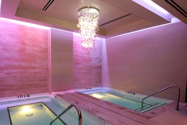 The high-end, professionally lit mirror stations and styling layout inside the Spa Mio salon facility in Henderson