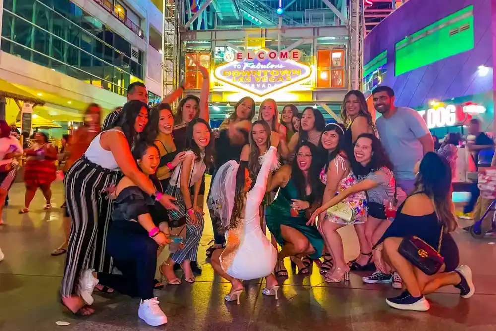 LA Epic Fremont Street Bar Crawl group celebrating during a Downtown Las Vegas nightlife crawl