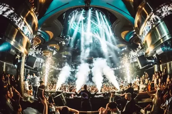 LA Epic Vegas Club Crawl guests at a Las Vegas nightclub with DJ lights dancing and party energy