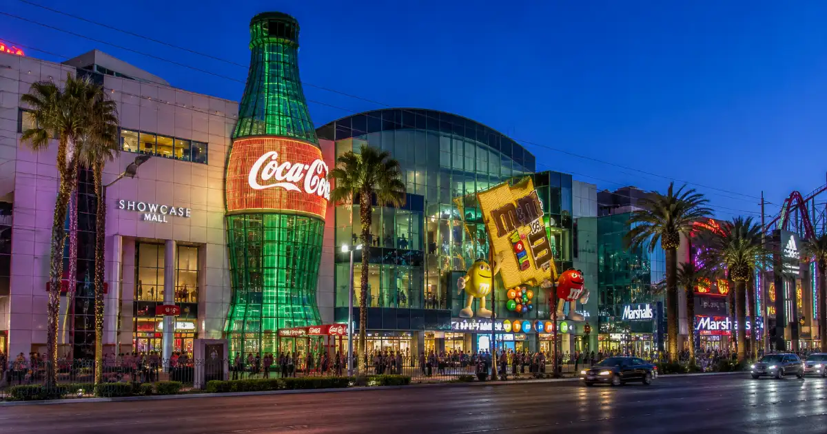 The Coca-Cola bottle, M&M’S World façade, palm trees, and Strip-facing entrances at Showcase Mall in Las Vegas.