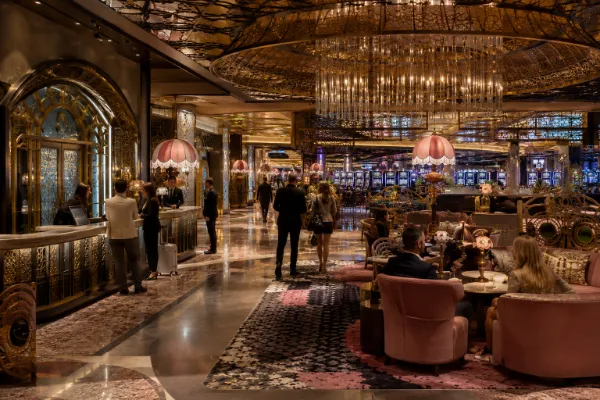 Guests move through the richly detailed casino-level interior of The Vanderpump Hotel on the Las Vegas Strip.