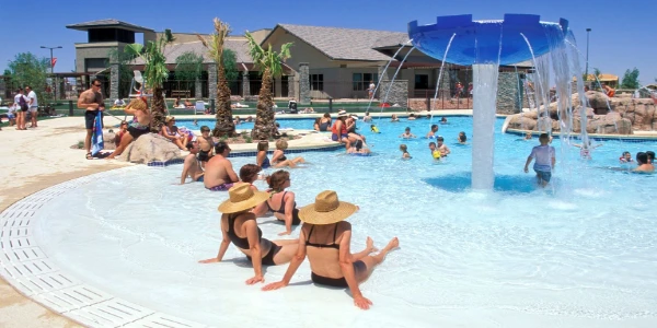 A wide-shot photo of people lounging and swimming at the Willows pool in Las Vegas