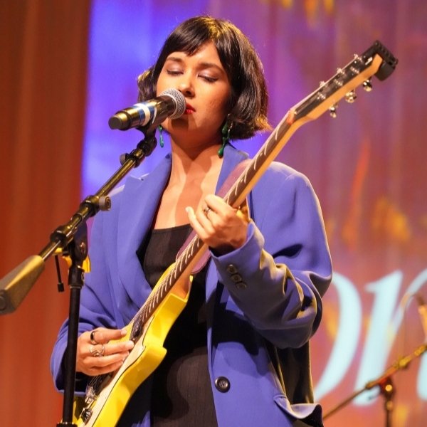 Sonia Barcelona performing with her guitar at Winchester Theater in Las Vegas.