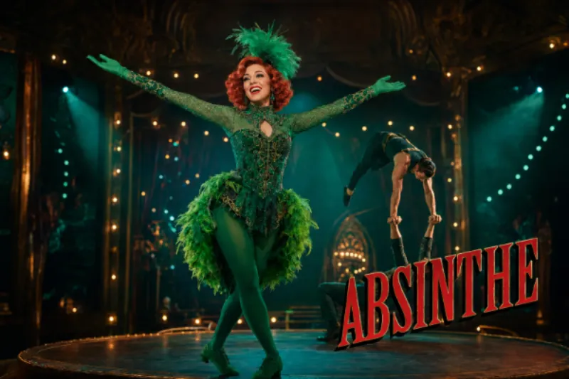 Green Fairy host and acrobats performing beneath the official-style Absinthe title at Caesars Palace in Las Vegas.