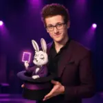 Magician holding a top hat with a rabbit mascot and glowing purple card for An R-Rated Magic Show.