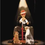 Gregory Popovich poses onstage with a dog and a cat.