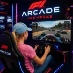 A guest races a Formula 1 simulator during an interactive gaming experience at F1 Arcade Las Vegas.