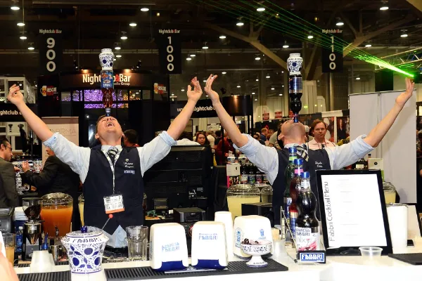 Las Vegas flair bartender tossing bottles and bar tools during drink service