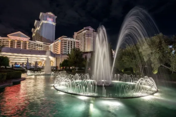Fountains illuminated at night outside Caesars Palace on the Las Vegas Strip