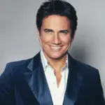 Gordie Brown poses wearing a blue blazer.