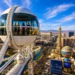 Passengers enjoy panoramic views of the Las Vegas Strip from a glass cabin on the High Roller Observation Wheel.