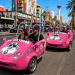 Guests drive colorful three-wheeled Hog Cars between local restaurants during a guided Las Vegas food tour.