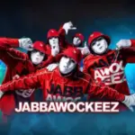 Jabbawockeez dance crew in red outfits and white masks.