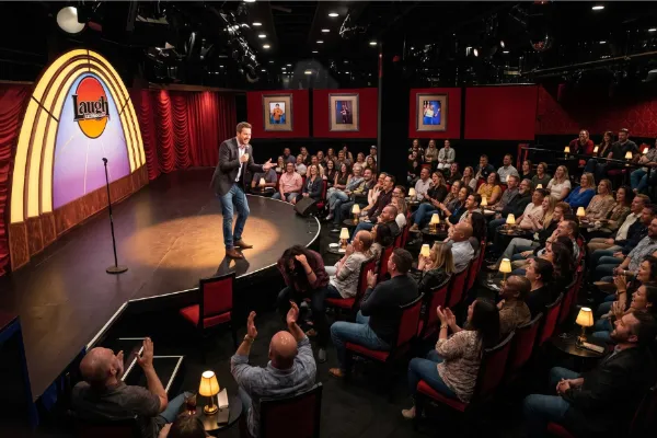 Stand-up comedian performing live for a laughing audience at Laugh Factory Las Vegas inside Horseshoe