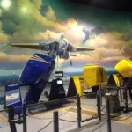 A military jet flies over guests experiencing a virtual reality simulator called Max Flight 360 in Las Vegas,