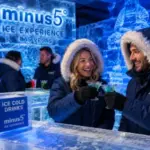 Guests wearing parkas enjoy ice sculptures and signature drinks inside the frozen Minus5 Ice Experience in Las Vegas.