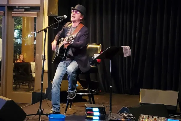 A perforer sings and plays the guitar at the Piazza Lounge inside the Tuscany Hotel & Casino in Las Vegas.