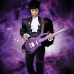 Purple Reign Prince tribute performer with a purple guitar.