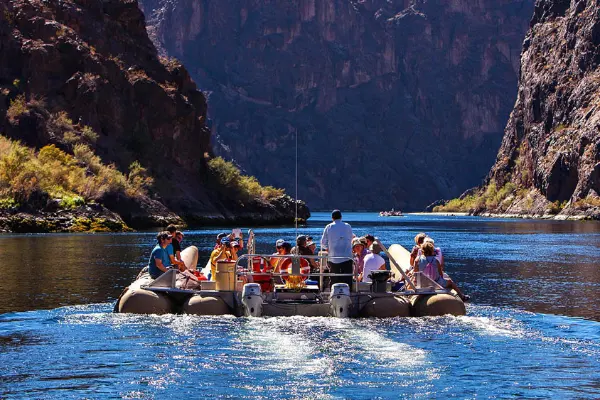 Raft tour guests floating on the Colorado River through Black Canyon near Hoover Dam