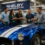 Guests explore classic Shelby performance cars during the Shelby American VIP Tour in Las Vegas.
