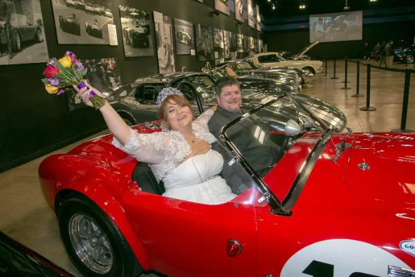 Wedding ceremony surrounded by Shelby performance cars at the Shelby Heritage Center in Las Vegas