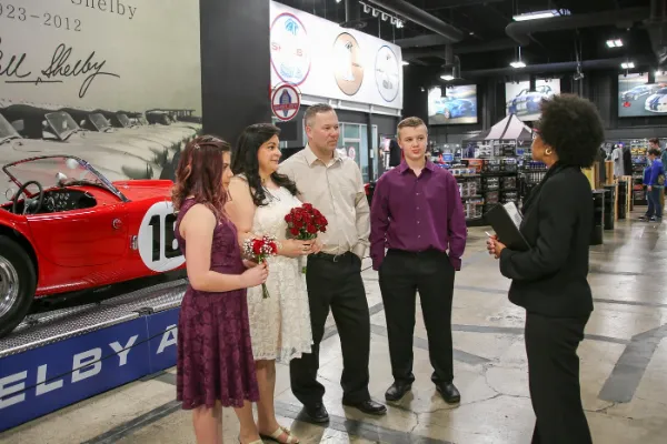 Private Shelby American wedding ceremony surrounded by classic performance cars in Las Vegas