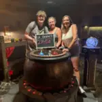 Escape room players celebrate their victory after beating the clock at the PanIQ Escape Room in Las Vegas.