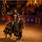 A knight on horseback thrills the audience during the medieval Tournament of Kings dinner show at Excalibur Las Vegas.