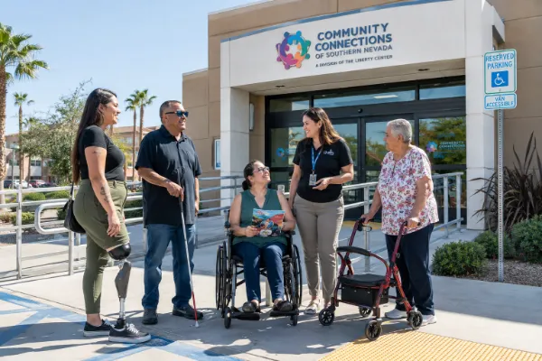 Adults with disabilities gather outside an accessible community resource building in Las Vegas