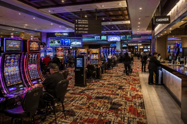 Guests play slot machines inside the reopened Primm Valley Resort and Casino in Nevada. 
