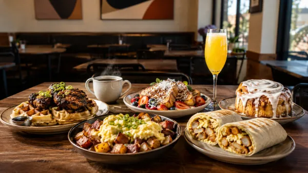 Chicken and waffles, breakfast hash, coconut French toast, a breakfast burrito, and cinnamon roll at a local Las Vegas café