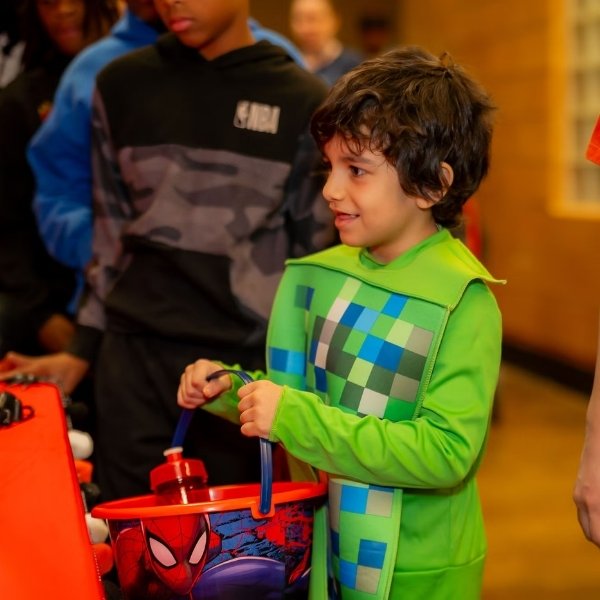 Families collecting Halloween candy at the Boo Bridge Trunk-or-Treat in Las Vegas