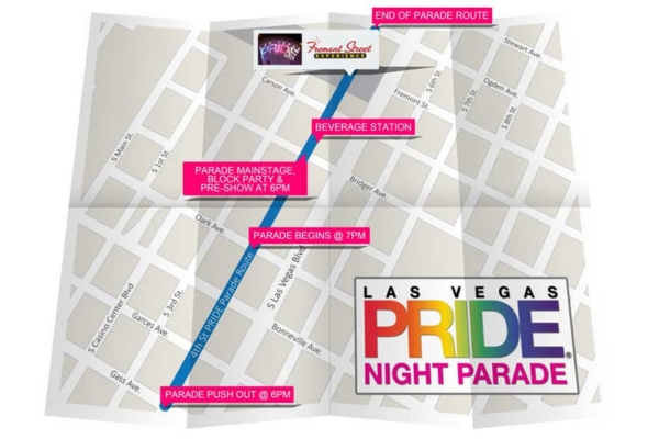 Las Vegas PRIDE supporters celebrating along the nighttime parade route in Downtown Las Vegas.