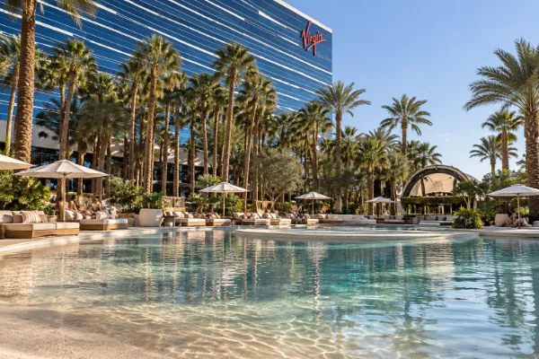 Poolside seating and cabanas at Kassi Beach Club at Virgin Hotels Las Vegas.
