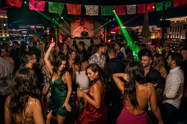 Adults dancing at a Las Vegas nightclub decorated for Mexican Independence Day Weekend
