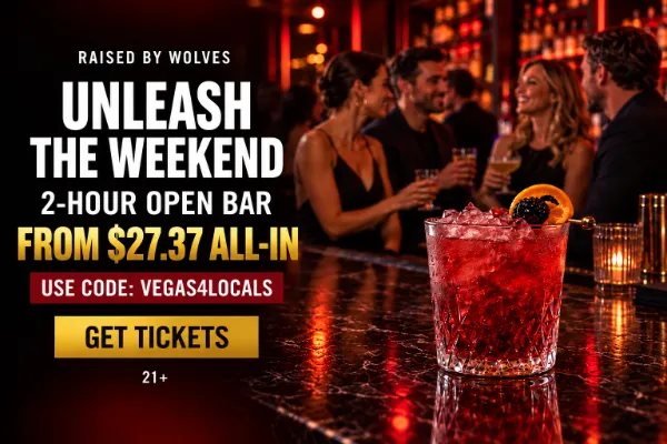 Raised by Wolves open bar offer with a premium red cocktail and adults socializing in a Downtown Las Vegas bar.