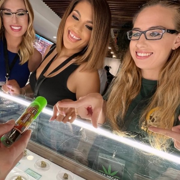 Guests exploring cannabis products during a guided Las Vegas dispensary tour
