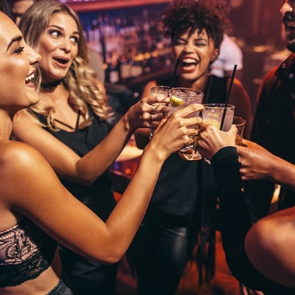 Friends raising their glasses during a New Year’s Eve nightclub celebration in Las Vegas